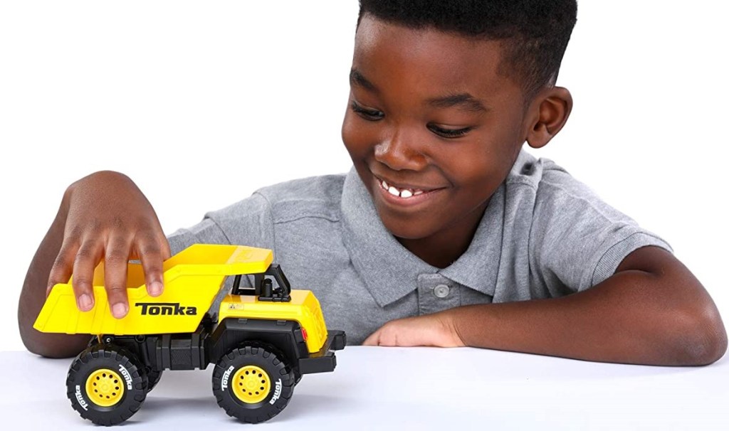 boy playing with a Tonka truck