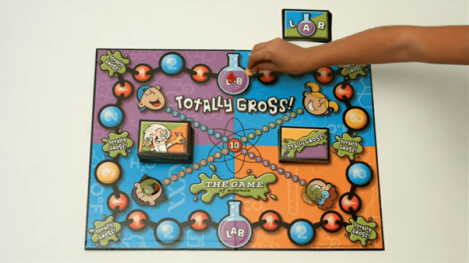 hand moving a piece on a board game