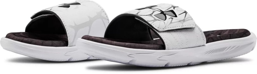 pair of black and white Under Armour sandals