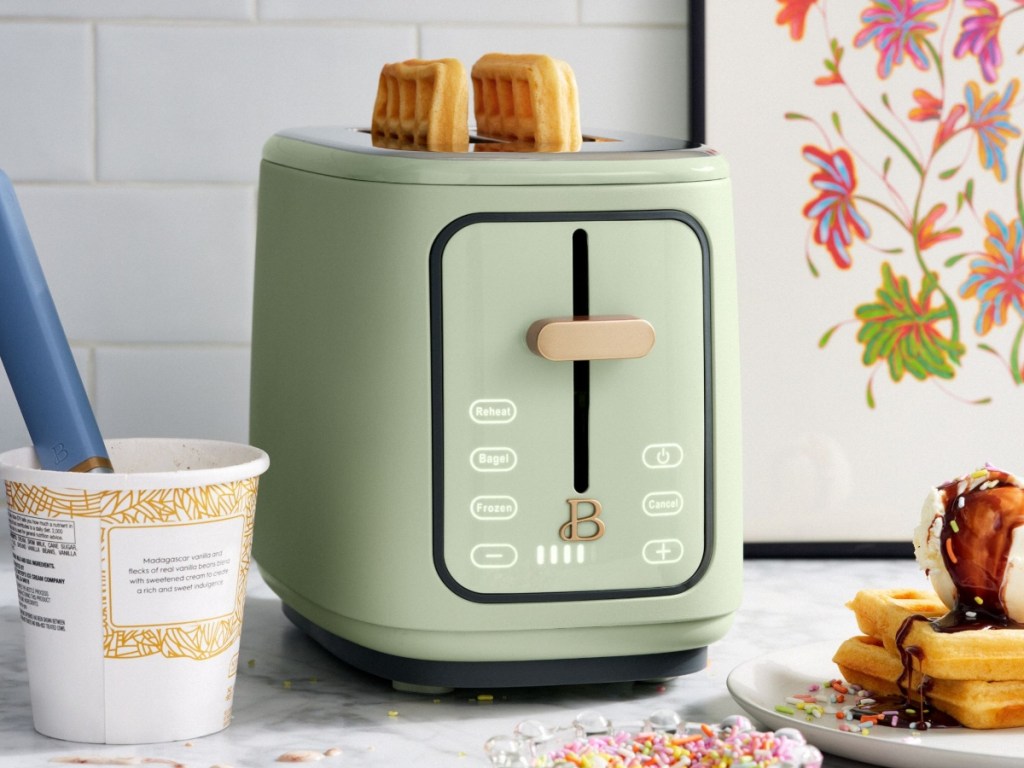 green toaster with waffles inside