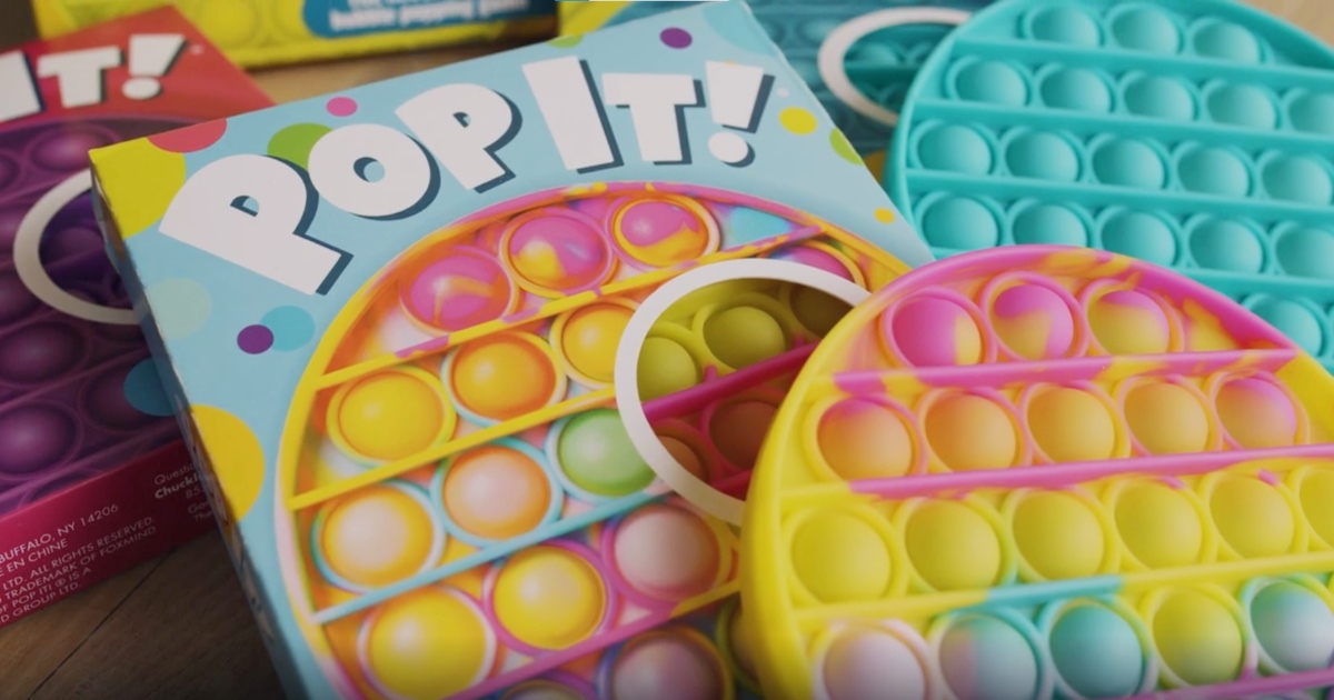 Pop-It games next to box