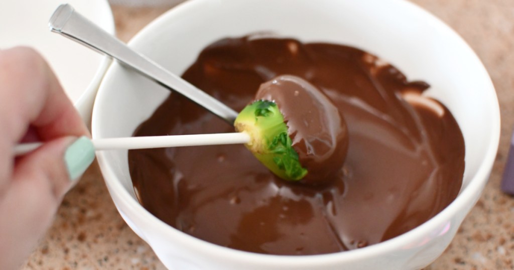 dipping a brussels sprout in candy melt april fools