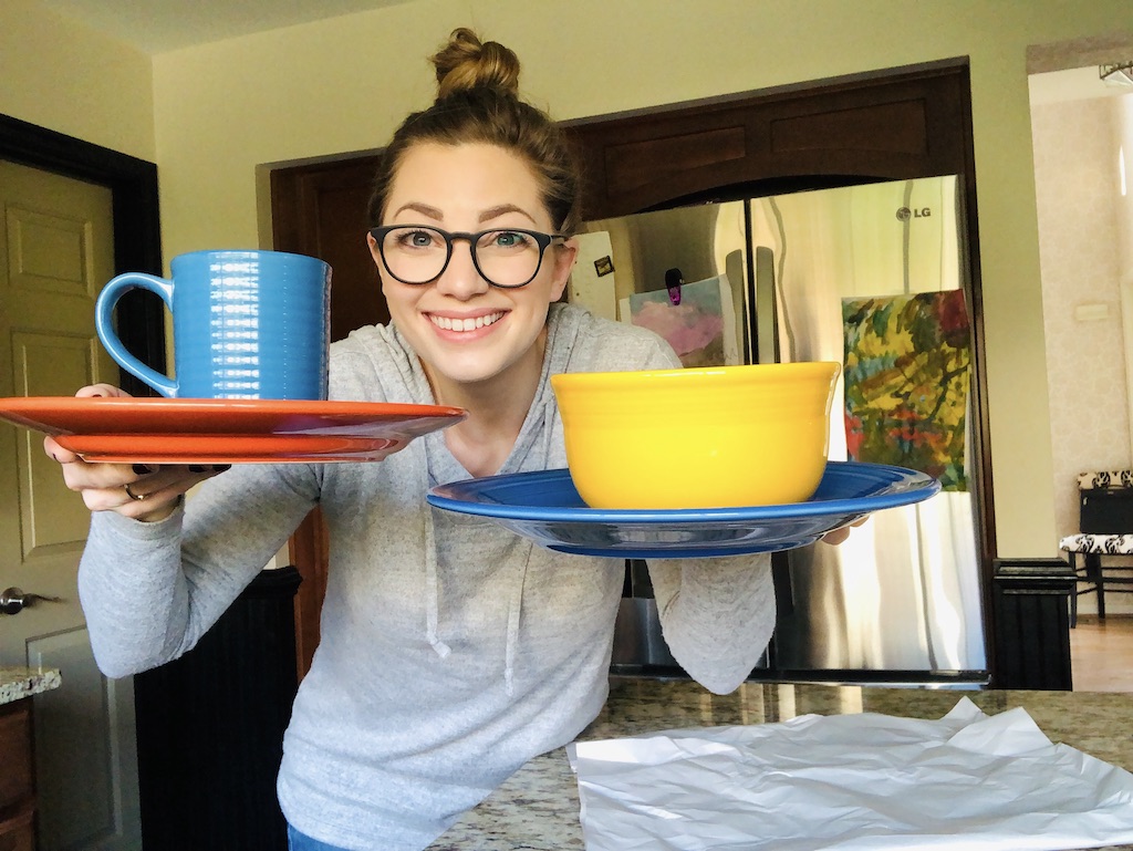 woman holding fiesta dinnerware dupes in the kitchen 