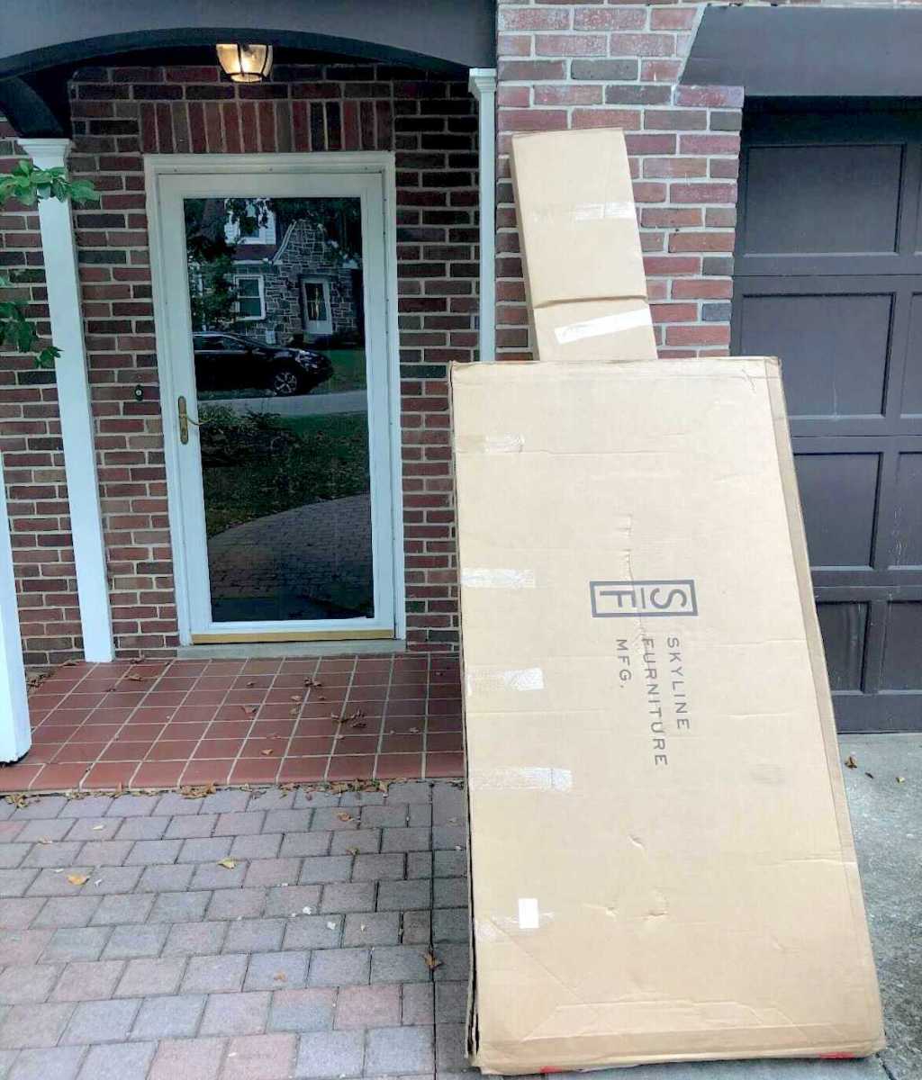 large boxes delivered to front porch outside