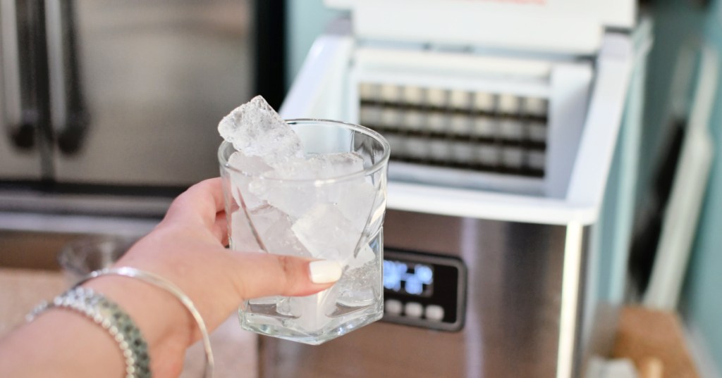 holding a cup of ice made from Euhomy ice maker