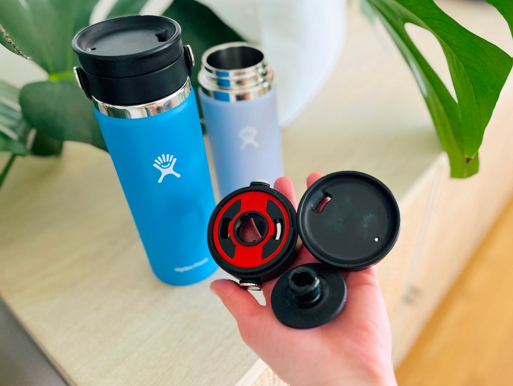 hand holding piece to hydro flask tumbler lid