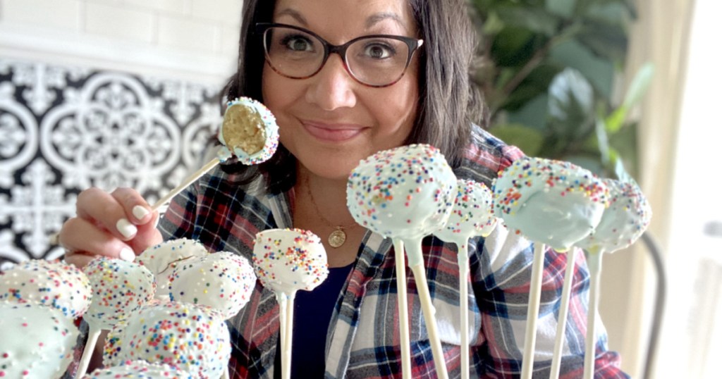woman holding cake pops