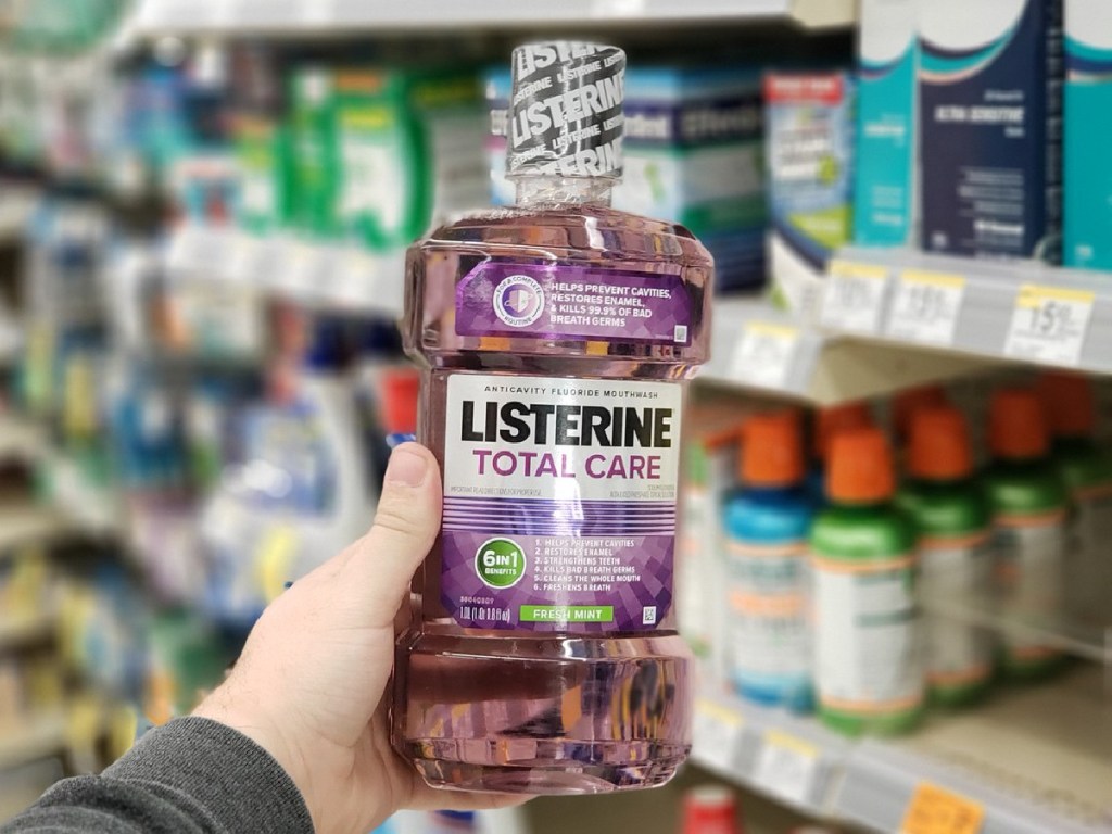 listerine total care fresh mint 1-liter bottle in hand