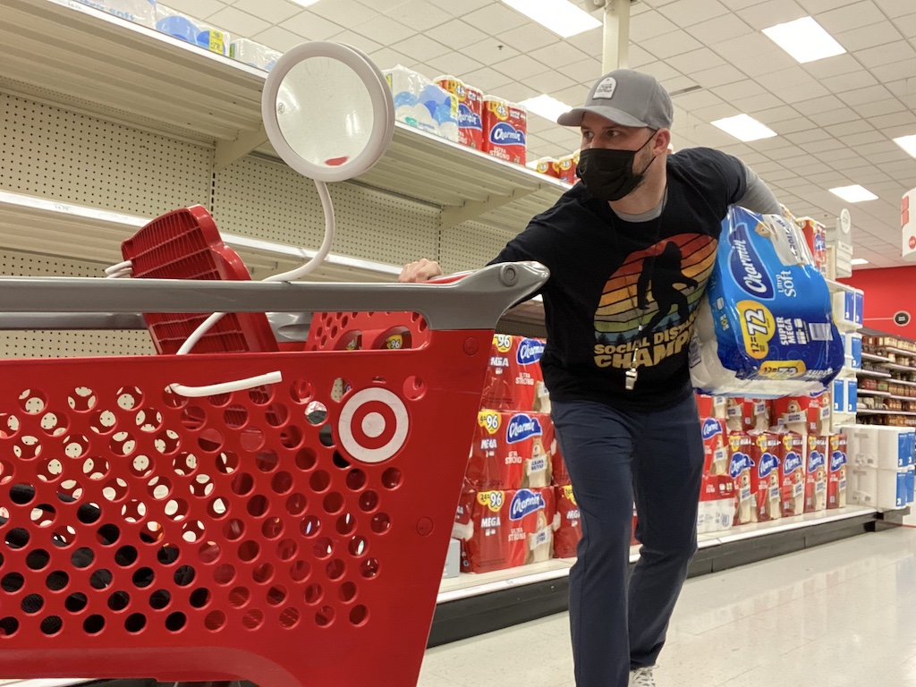 man at Target wearing mask with Charmin toilet paper 