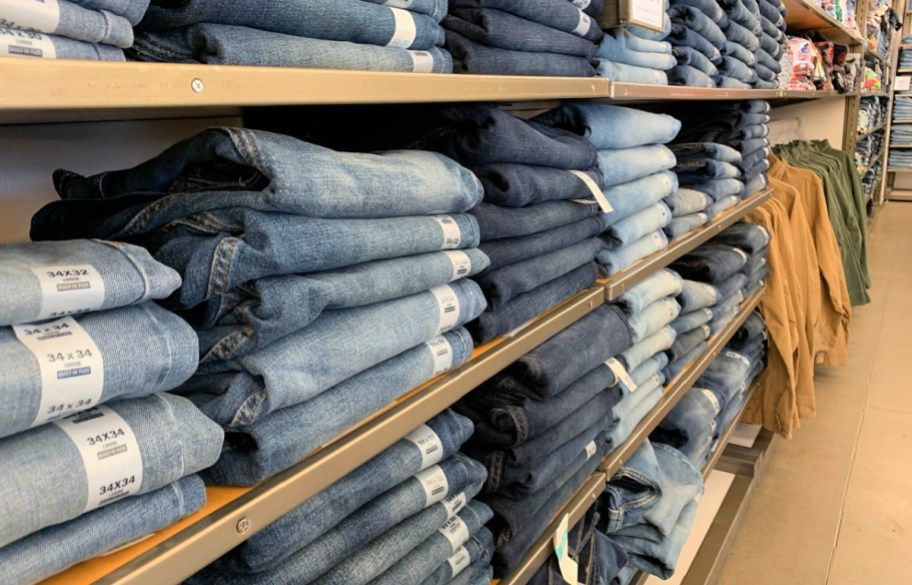 men's jeans folded and sitting on display at old navy