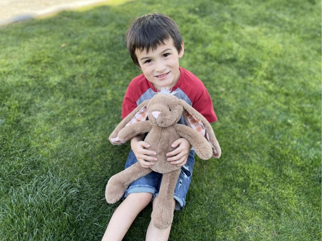 boy holding tan Easter bunny