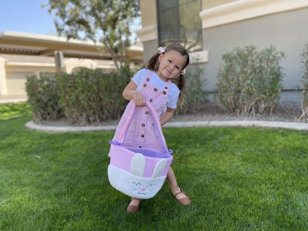 girl holding Easter bunny basket