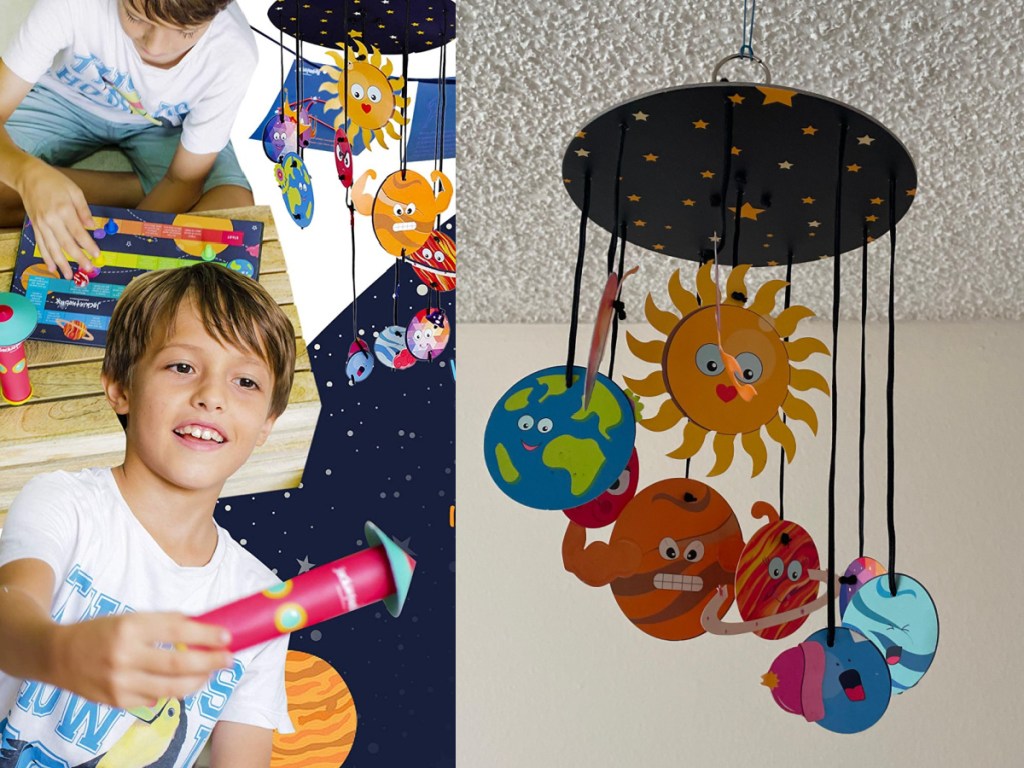 boy playing with space kit and space mobile