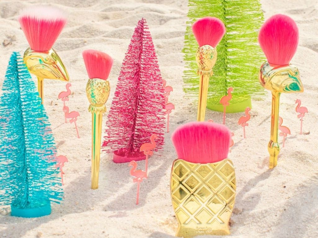 gold Flamingo brush set in sand