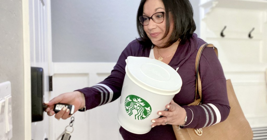 woman holding giant centa starbucks coffee