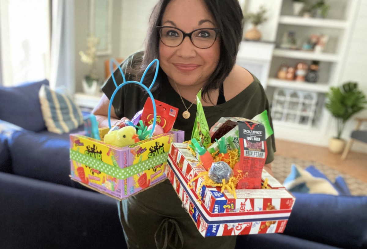 woman holding two edible easter baskets
