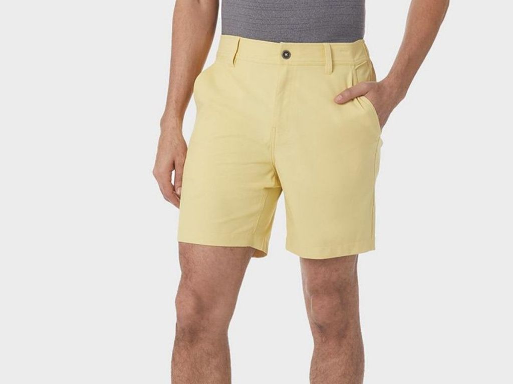 man wearing yellow shorts