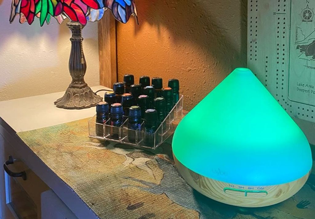 diffuser and essential oils on a table