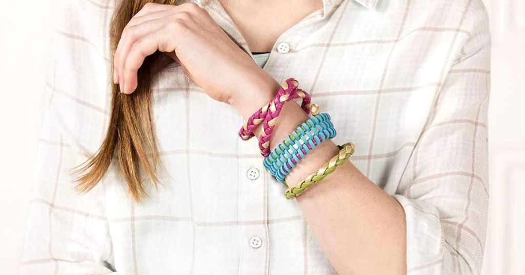 teen with bracelets on her arm
