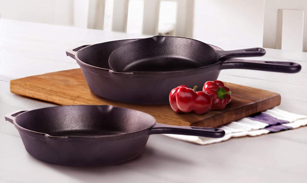 three cast iron pans