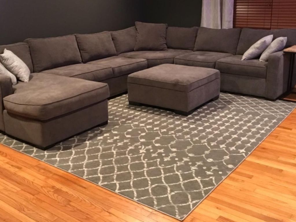 Living room with sectional couch and area rug
