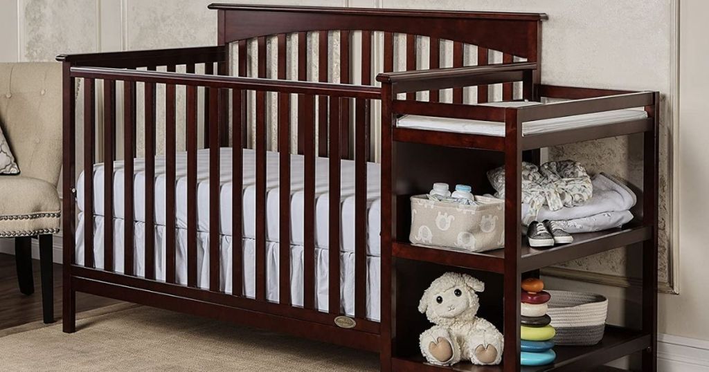 crib with a changing table attached