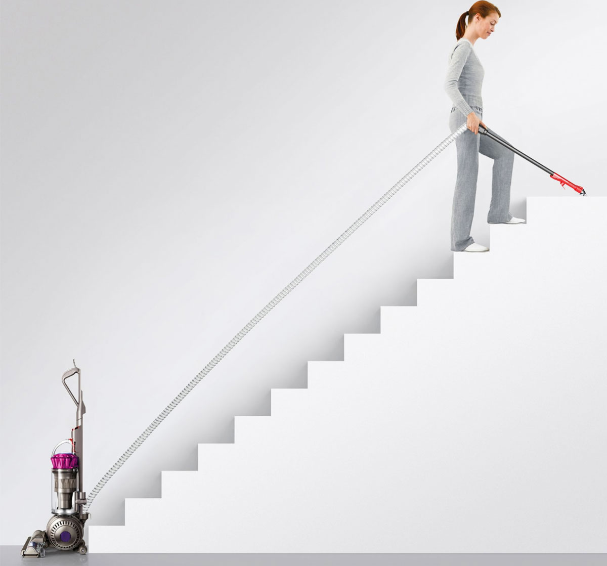 woman using dyson to clean stairs