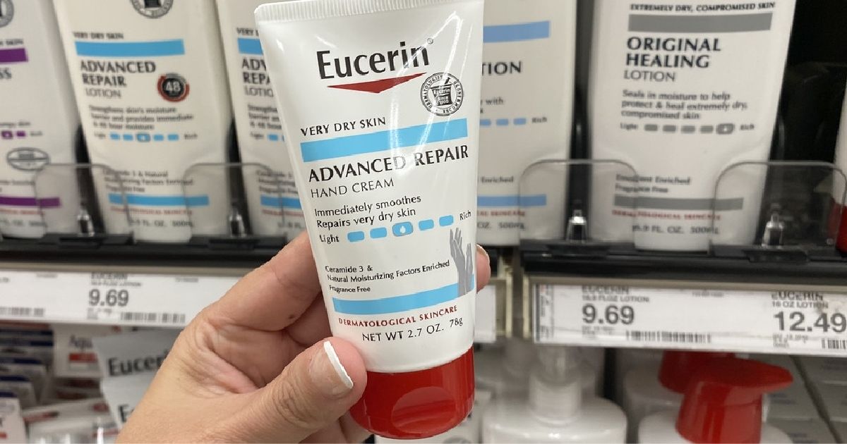 hand holding Eucerin Advanced Repair Hand Cream in store
