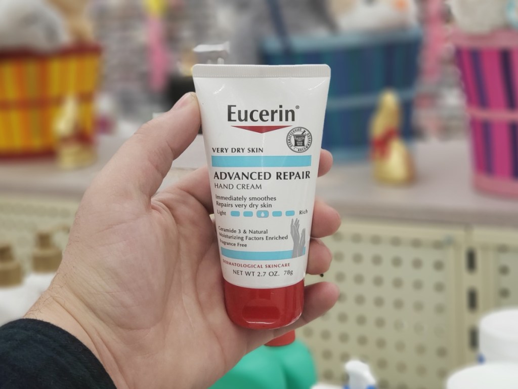 hand holding eucerin advanced hand cream