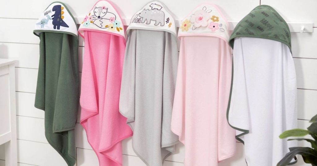 row of hooded towels on hangers