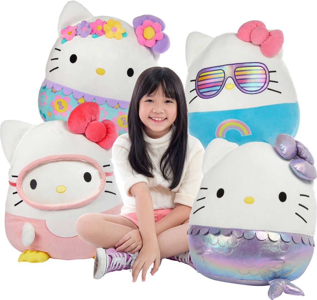 girl sitting with Hello Kitty Squishmallows
