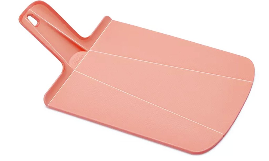coral colored cutting board with handle