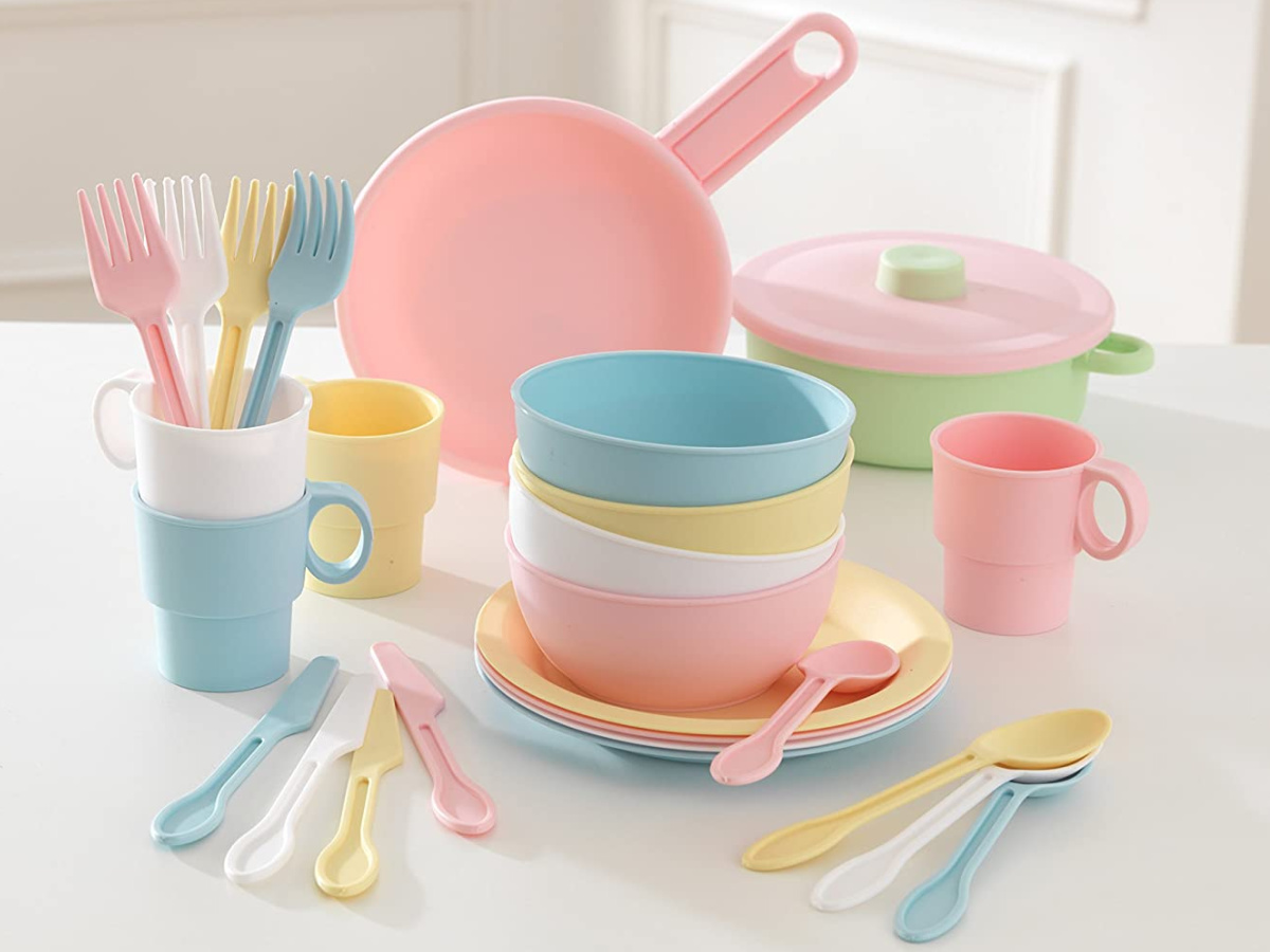kids pastel plastic dishes set displayed on a table