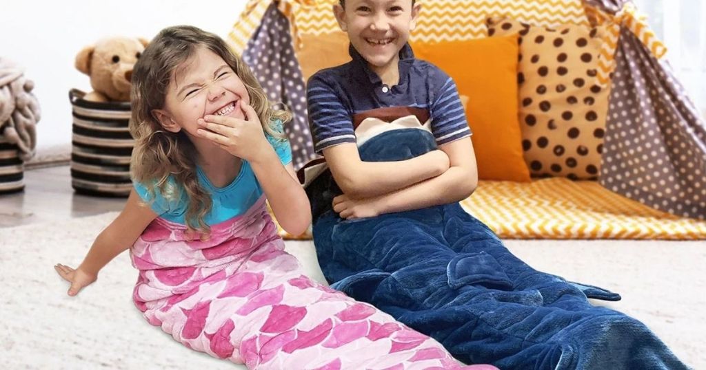 two kids wearing a weighted blanket