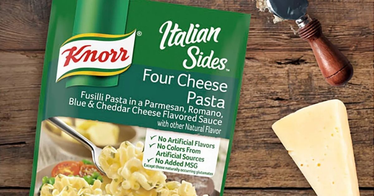Knorr Pasta Sides on wood with block of cheese and cheese slicer