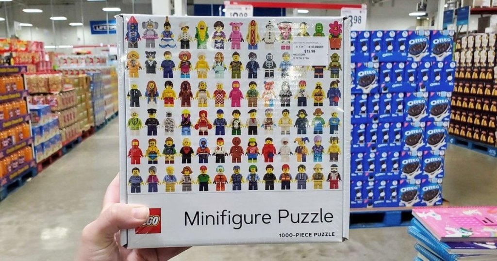 person holding up a lego minifigure jigsaw puzzle