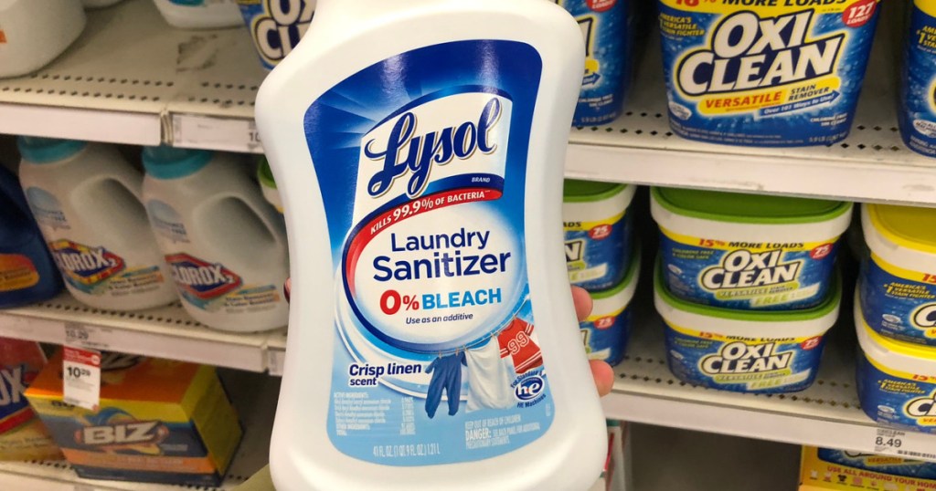 hand holding lysol laundry sanitizer