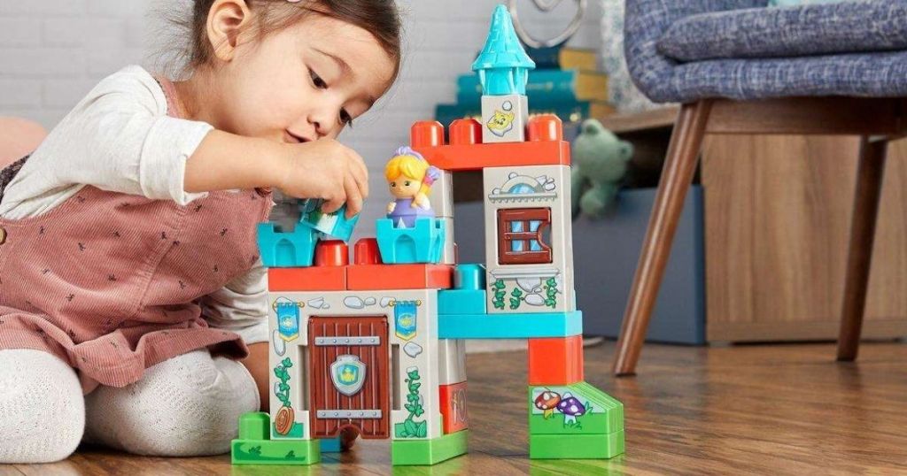 child playing with Mega Bloks Storytelling Castle