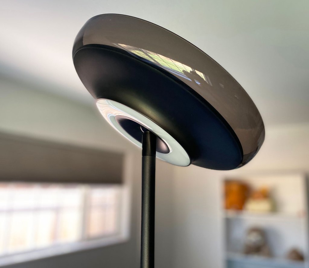 black floor lamp with lights on either side of the head