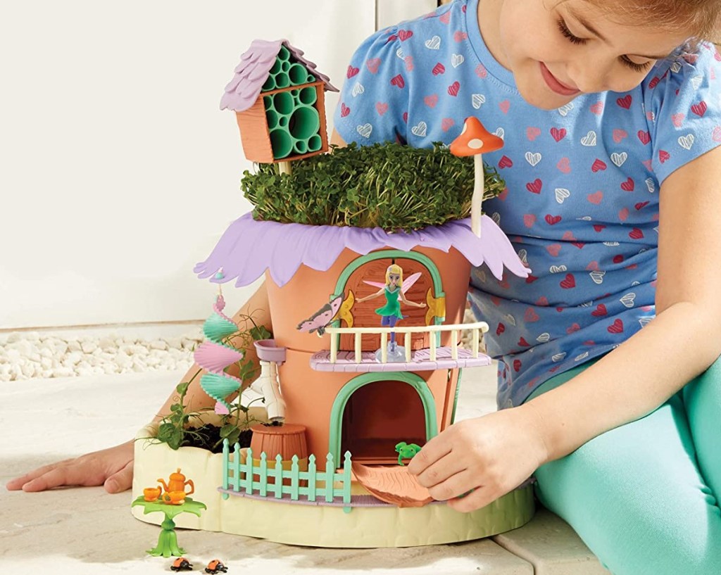 girl playing with a Fairy Garden set