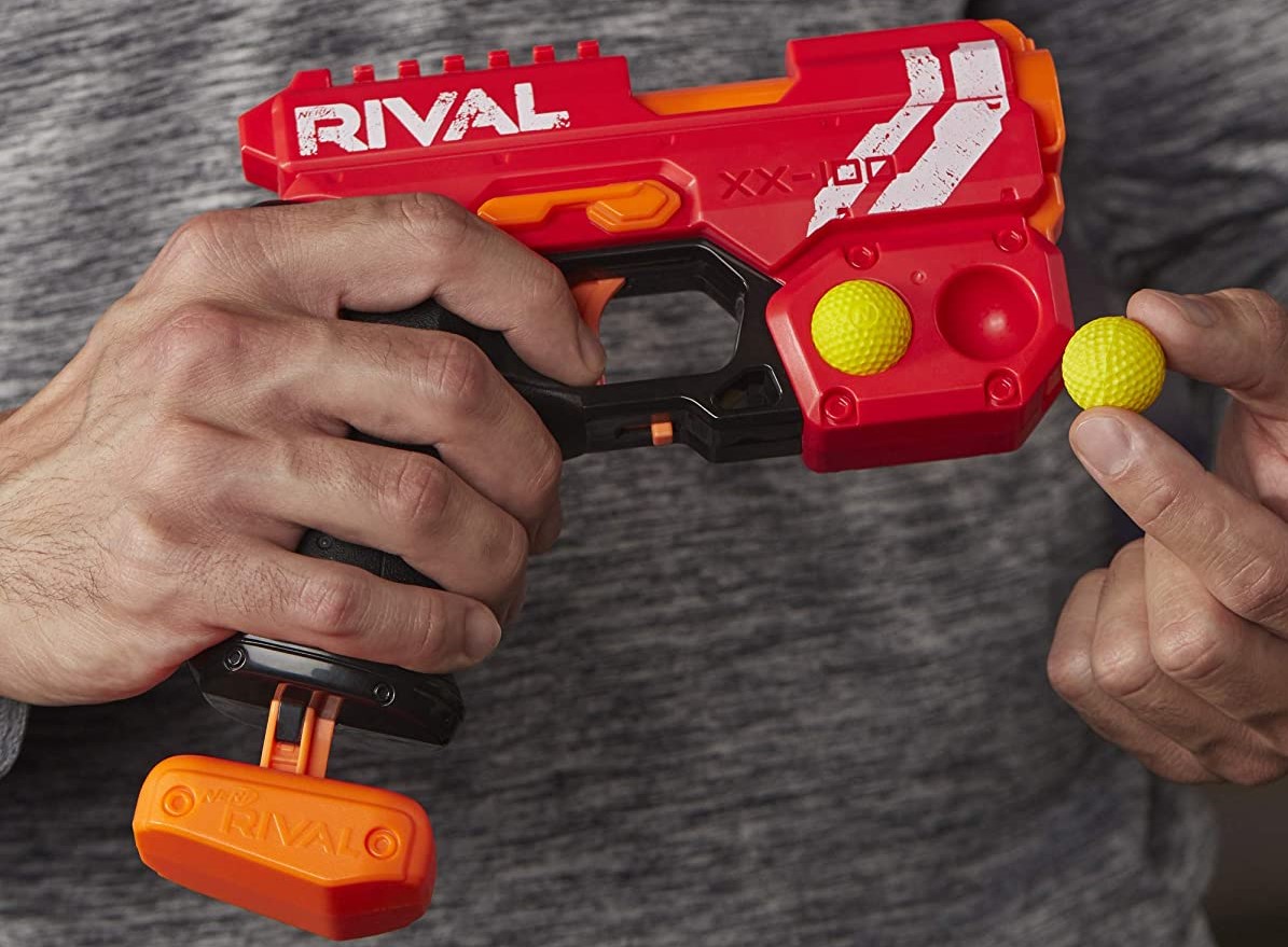 hands holding a NERF blaster