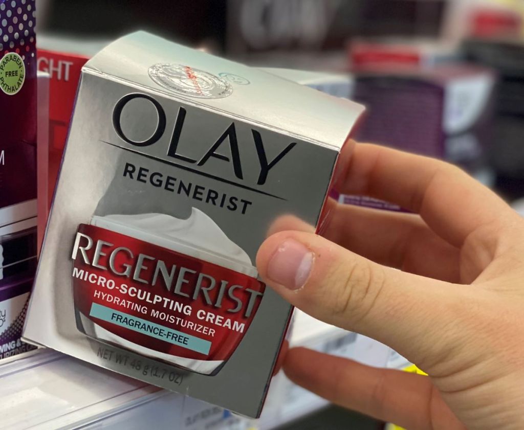 hand holding an Olay Regenerist box