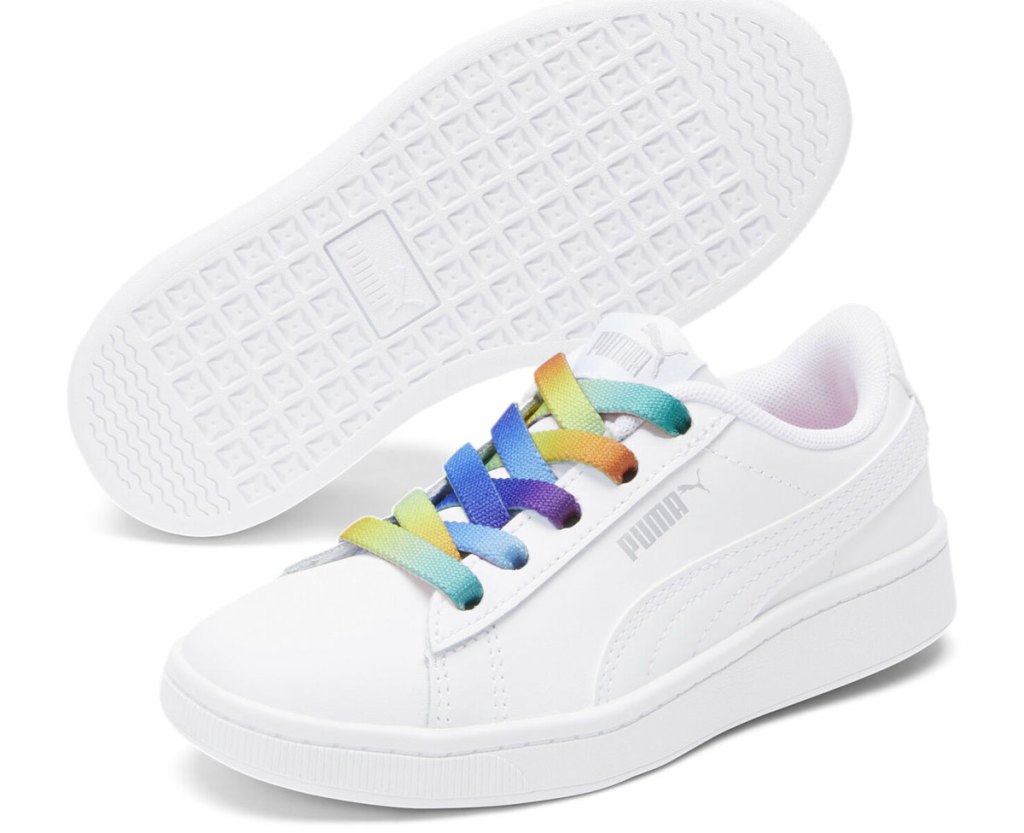 pair of white shoes with rainbow laces