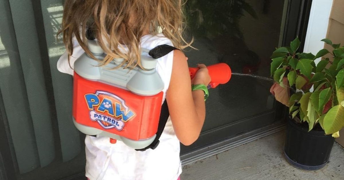 Little girl playing with Paw Patrol Water Rescue Backpack