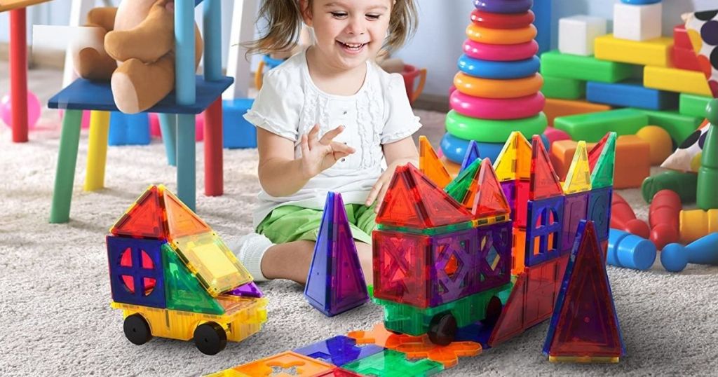 girl playing with magnetic blocks