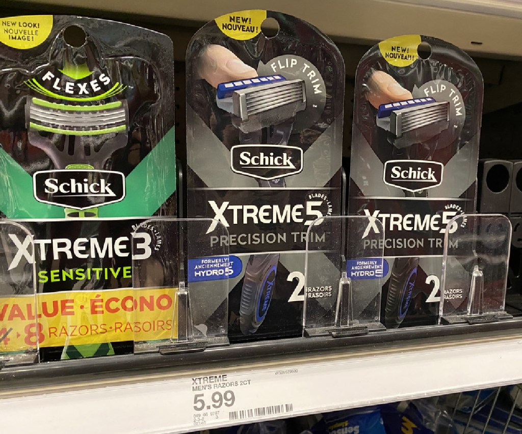 packs of men's disposable razors on store shelf