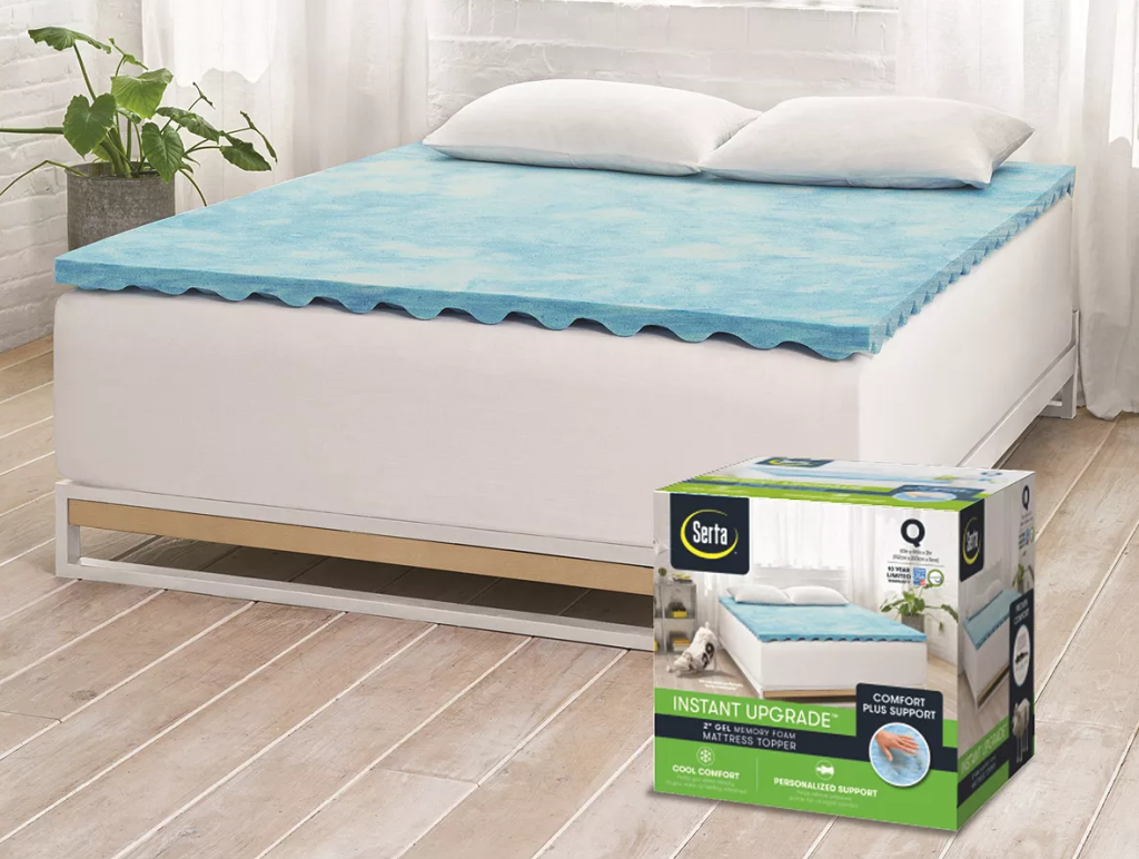 bed with a mattress topper on it