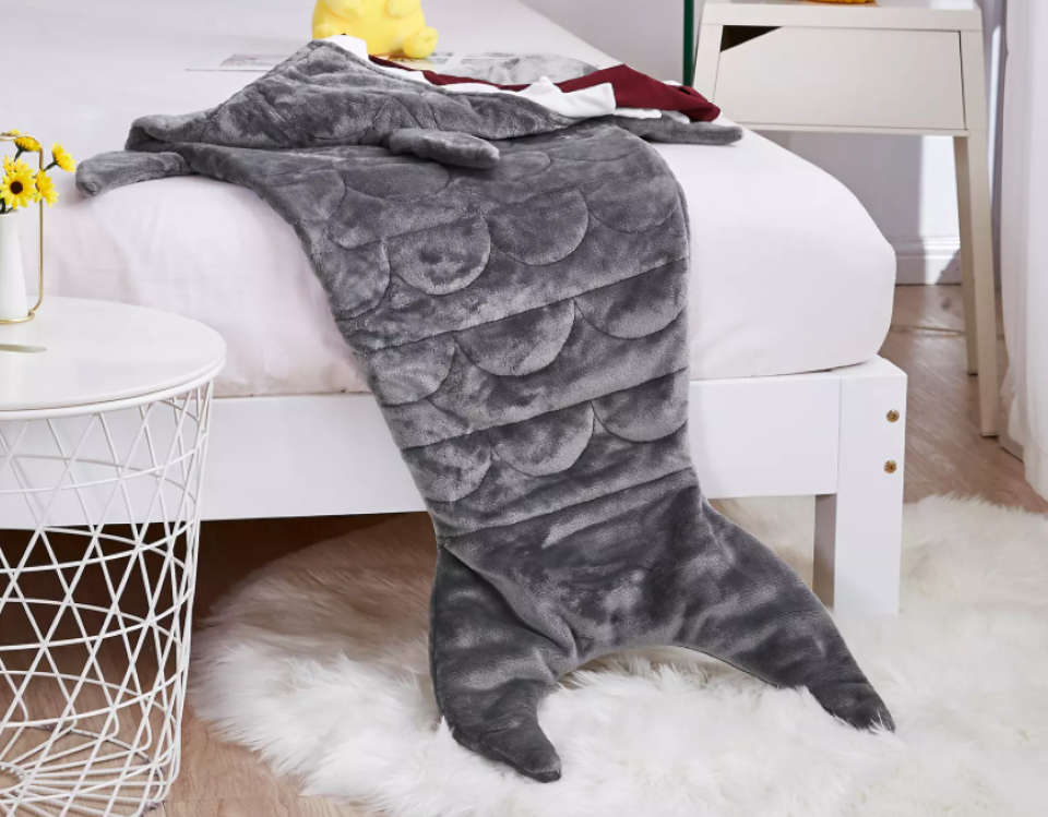Shark Weighted Blanket on a bed