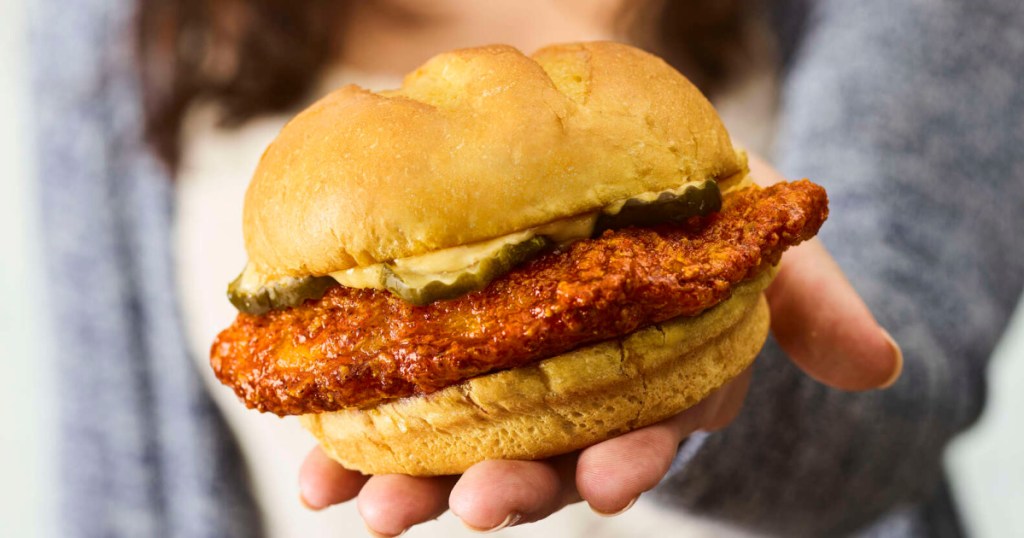 woman holding a chicken sandwich