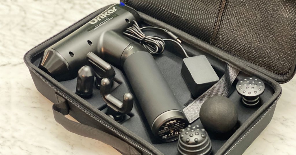 black massage gun and attachments in carrying case